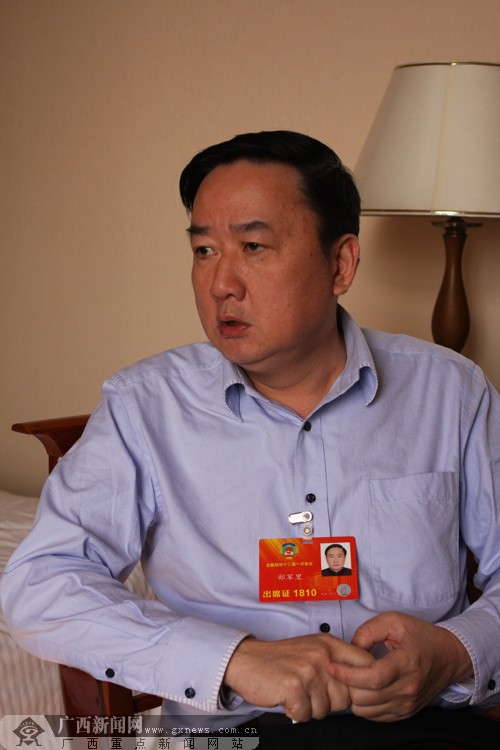 全国政协委员郑军里建议加大对广西旅游扶贫支持